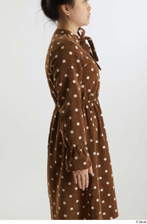 Aera  1 arm brown dots dress casual dressed flexing…